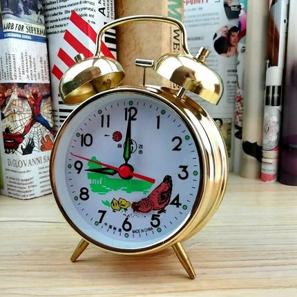 Mekanisk vækkeur med dobbeltklokke i guld