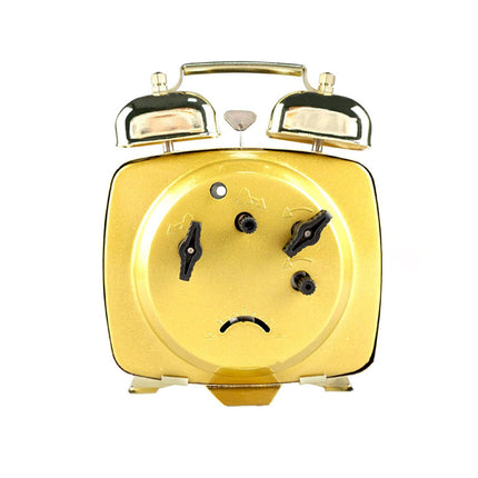 Lille firkantet mekanisk vækkeur i guld