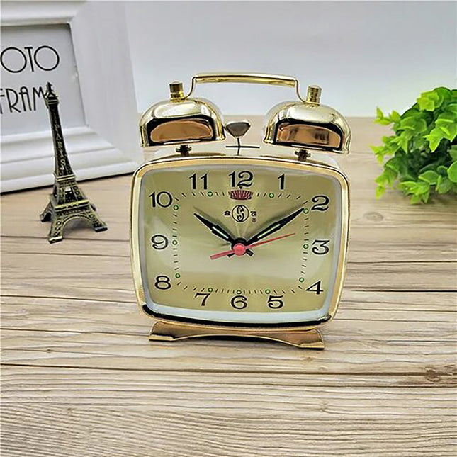 Lille firkantet mekanisk vækkeur i guld