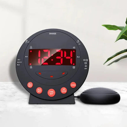 Sort vækkeur med sengevibrator