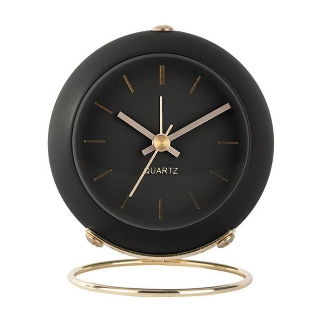 Sort vintage vækkeur på guld stander