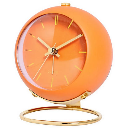 Orange vintage vækkeur på guld stander