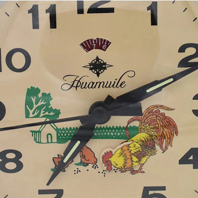 Retro mekanisk vækkeur med hane motiv